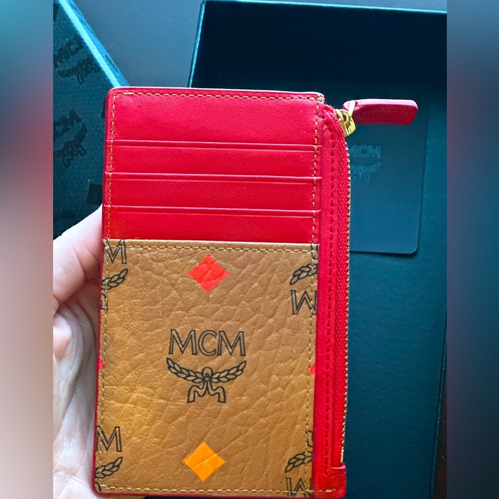 LIKE NEW MCM Red and Tan Allover Logo Printed Zipped Card Holder.